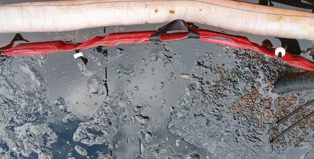 An oil spill in a controlled water basin.