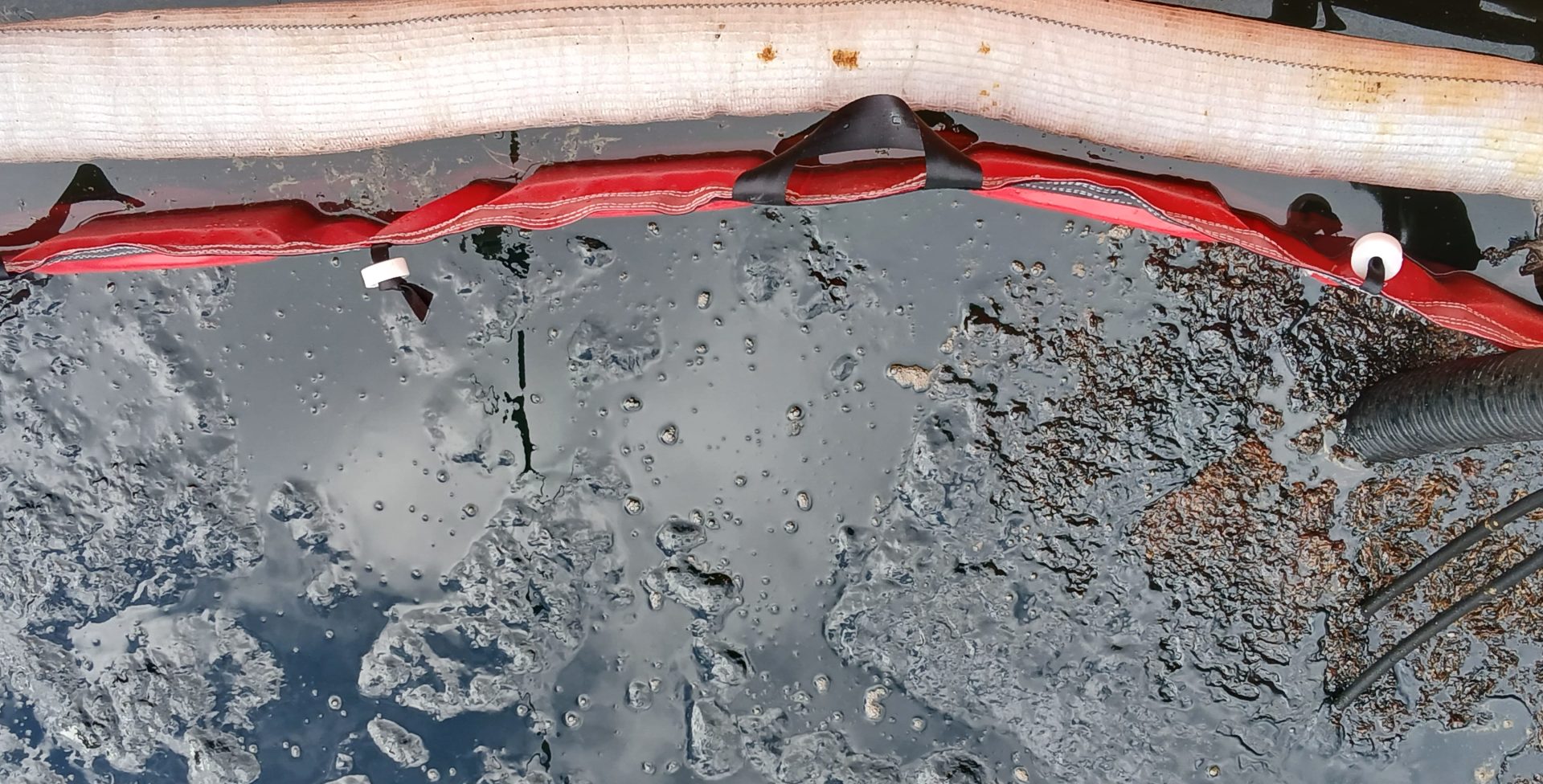 An oil spill in a controlled water basin.