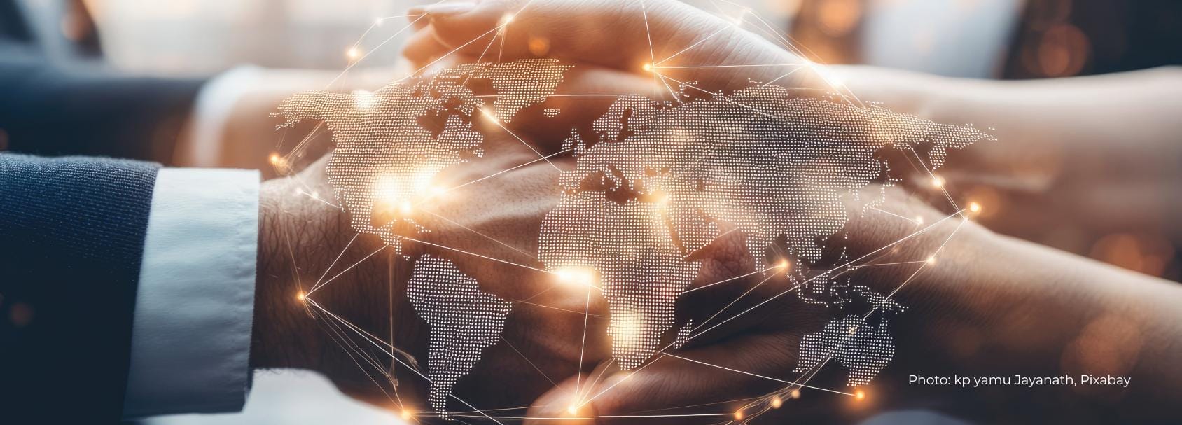 Two person shwing hands in hand, a piece of a global map on the top.