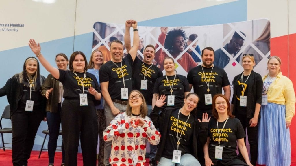 Xamk's students and staff in a group picture with celebrating poses.